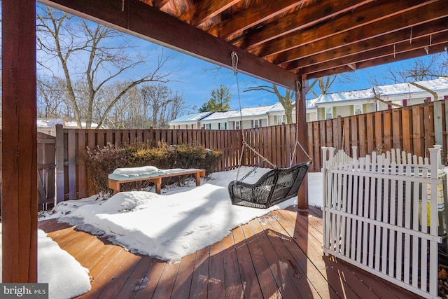 view of snow covered deck