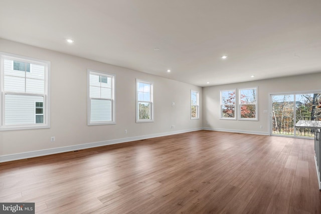 unfurnished room featuring hardwood / wood-style flooring