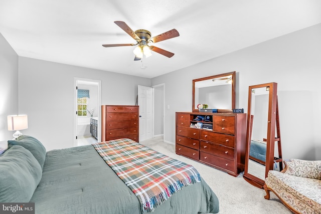 carpeted bedroom with ceiling fan and ensuite bathroom