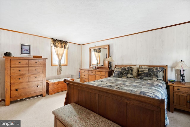 carpeted bedroom with a textured ceiling and crown molding