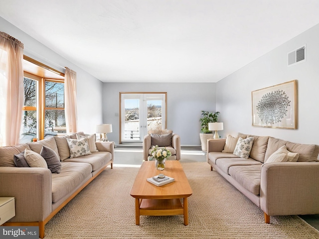 carpeted living room with french doors