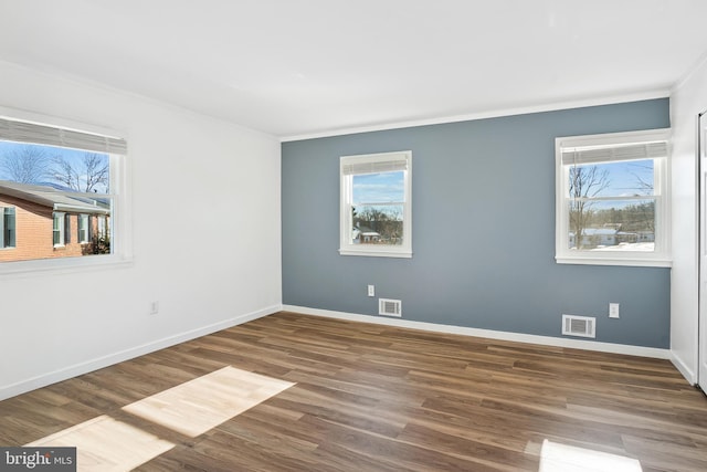 spare room featuring dark wood-type flooring