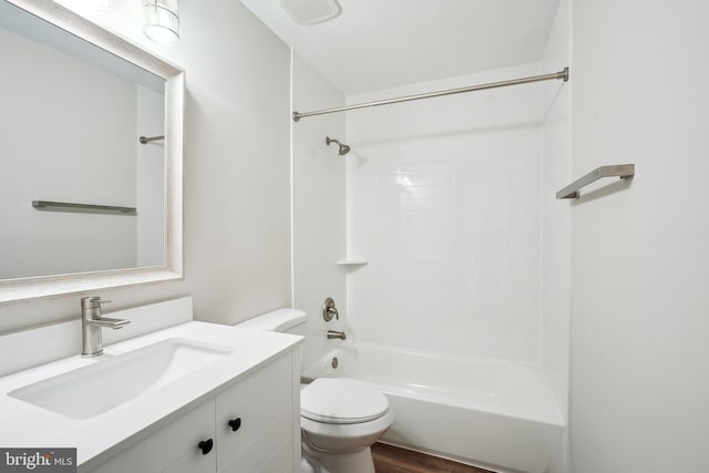 full bathroom with toilet, wood-type flooring, shower / washtub combination, and vanity