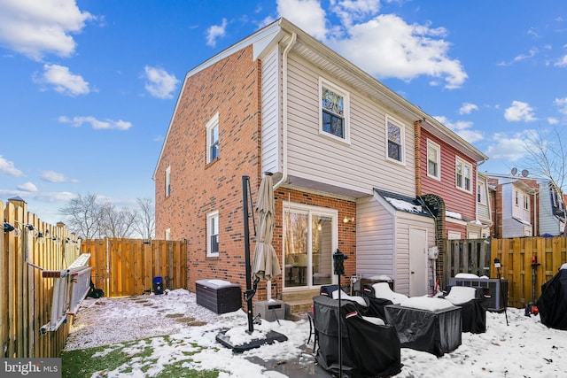 view of snow covered house