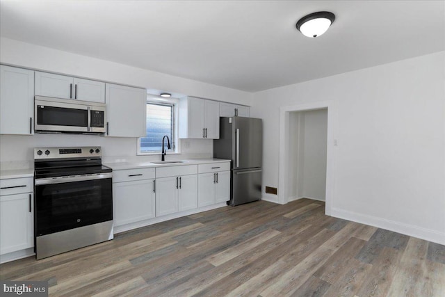 kitchen featuring sink, white cabinetry, and appliances with stainless steel finishes