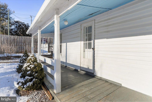 view of snow covered deck