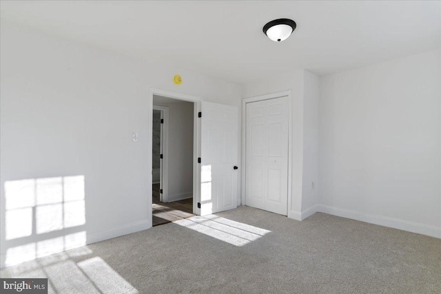 spare room with light colored carpet