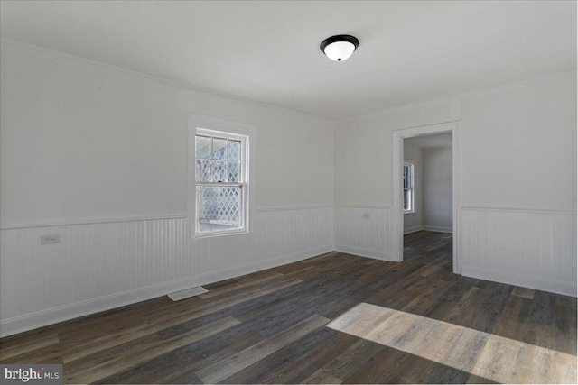 empty room featuring dark wood-type flooring