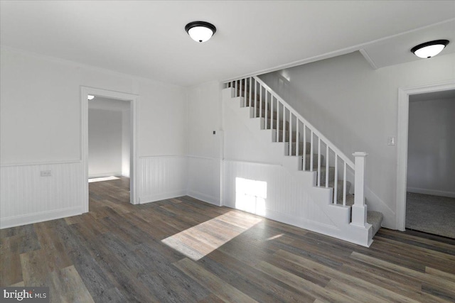 staircase with hardwood / wood-style flooring