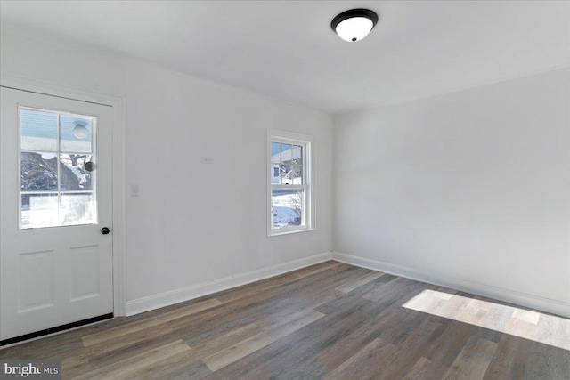 interior space with dark wood-type flooring and a wealth of natural light