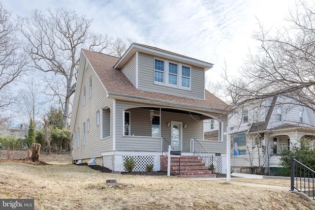 view of front of home featuring a porch and a shingled roof