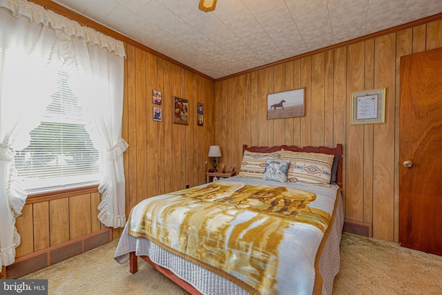 carpeted bedroom with wooden walls