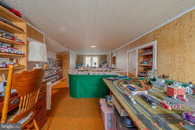 interior space featuring light carpet, crown molding, and wood walls