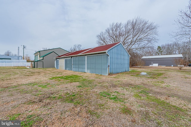 view of outdoor structure with a lawn