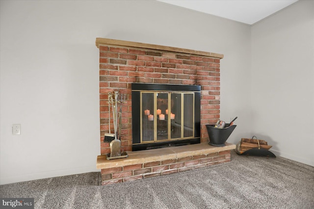 details featuring a brick fireplace and carpet