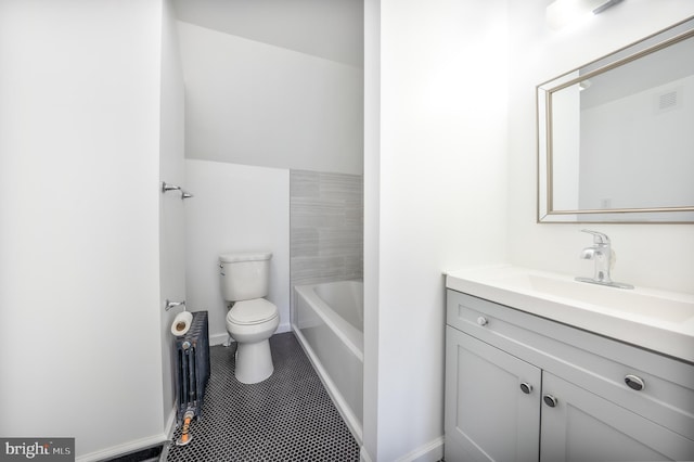 bathroom featuring tile patterned flooring, toilet, radiator, a bathtub, and vanity