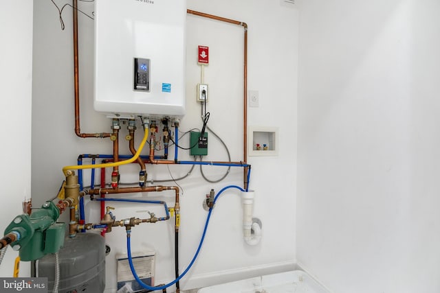 utility room with tankless water heater