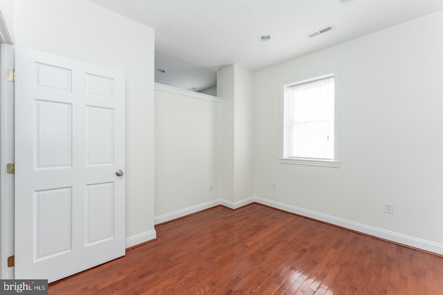 empty room with wood-type flooring