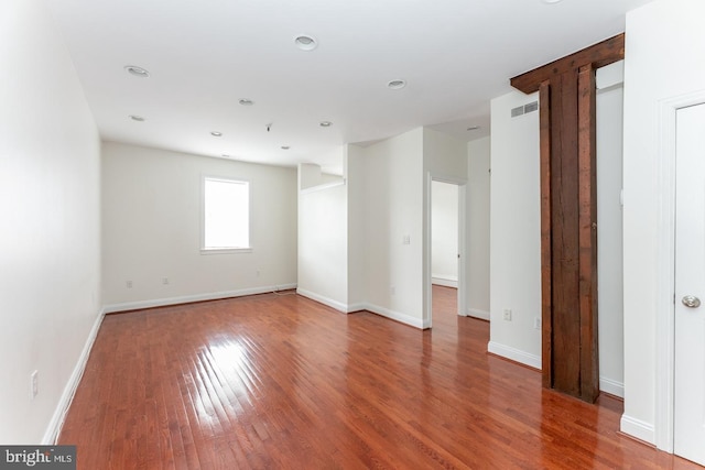 unfurnished room featuring hardwood / wood-style flooring