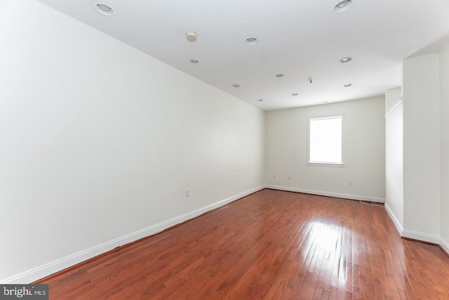 empty room with hardwood / wood-style flooring