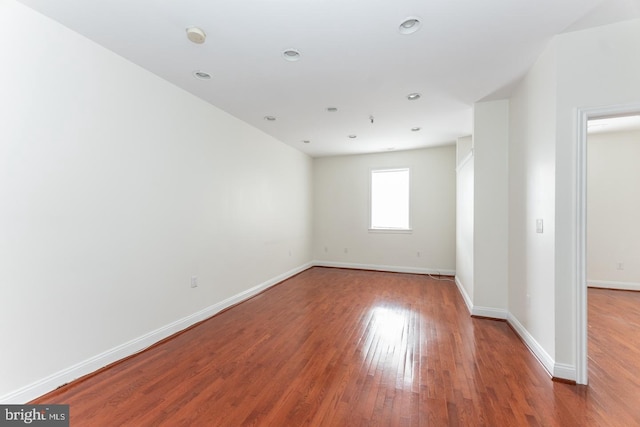 spare room with wood-type flooring