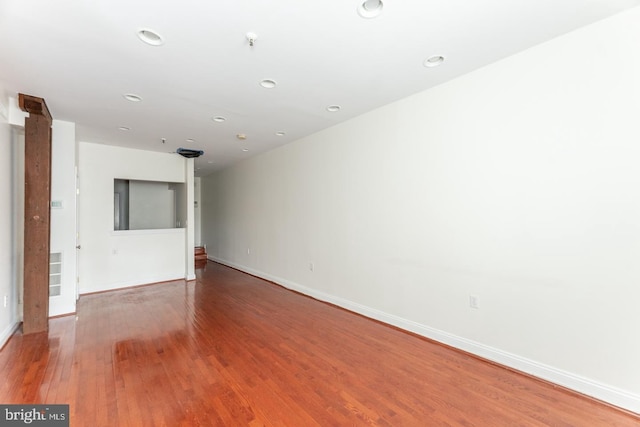 empty room featuring hardwood / wood-style flooring