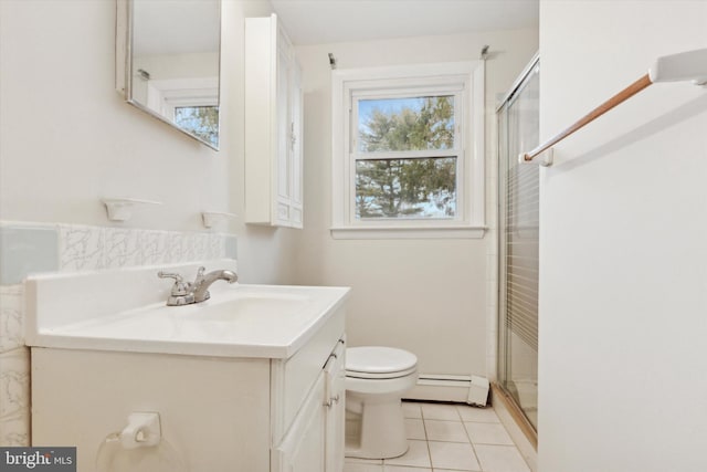 bathroom featuring toilet, an enclosed shower, vanity, and a baseboard heating unit