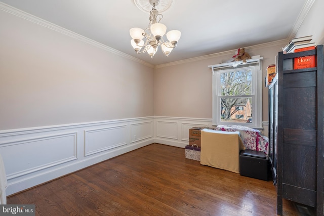 unfurnished dining area with ornamental molding, dark hardwood / wood-style floors, and a chandelier