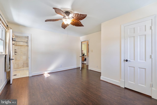 unfurnished bedroom with ceiling fan and dark hardwood / wood-style floors