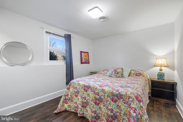 bedroom featuring dark wood-type flooring