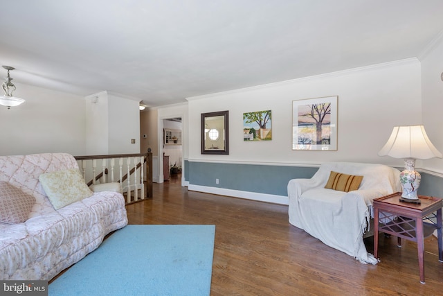 living room with crown molding and dark hardwood / wood-style flooring