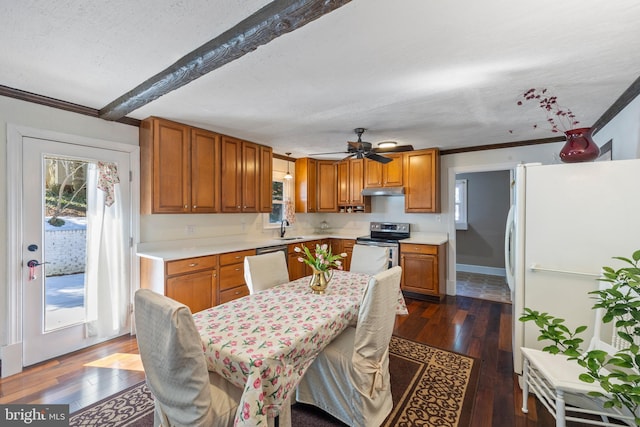 kitchen with sink, ornamental molding, dark hardwood / wood-style floors, stainless steel appliances, and beam ceiling