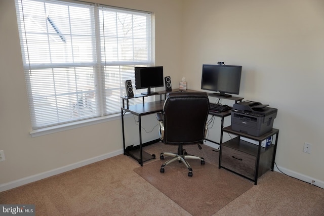 office space featuring light carpet and a wealth of natural light