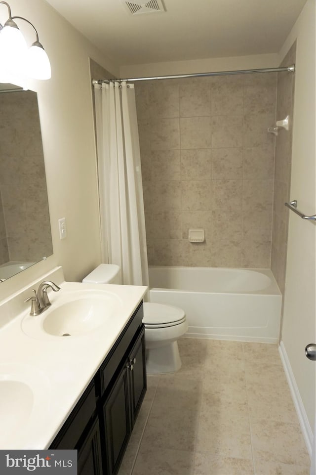 full bathroom featuring toilet, vanity, and shower / tub combo with curtain