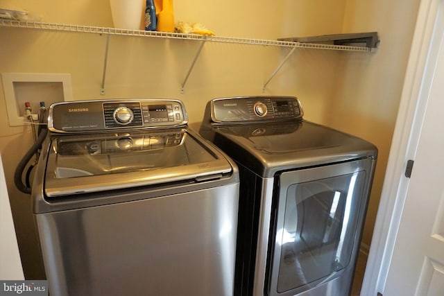 laundry area with washer and clothes dryer