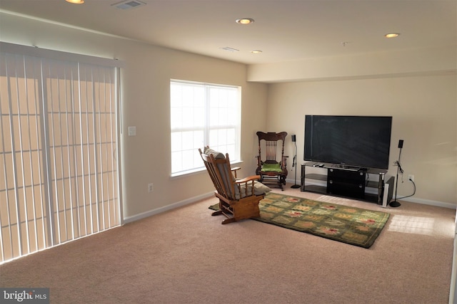 sitting room with carpet floors