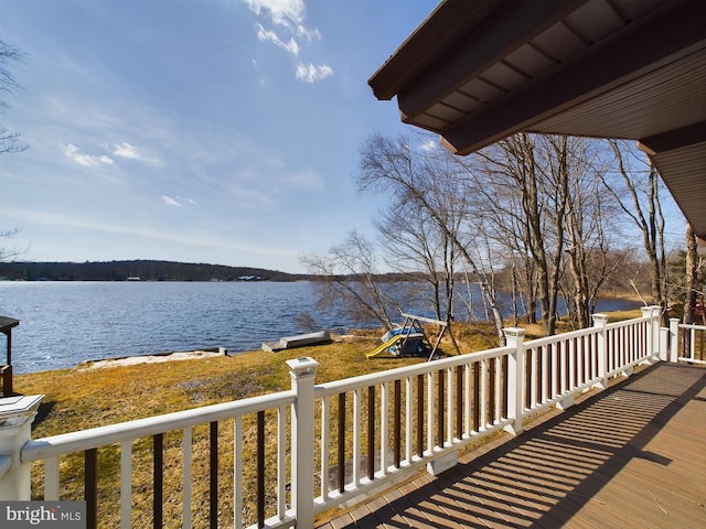 deck featuring a water view