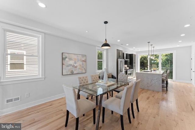 dining area with light wood-type flooring