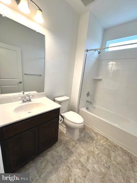 full bathroom with toilet, shower / bath combination, and vanity