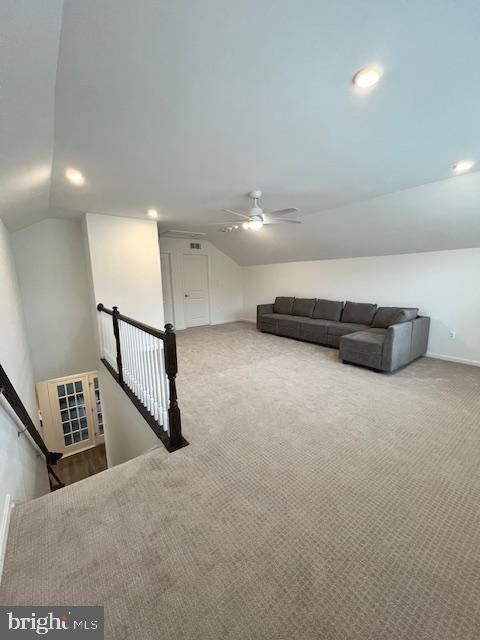 additional living space with lofted ceiling, ceiling fan, and carpet floors