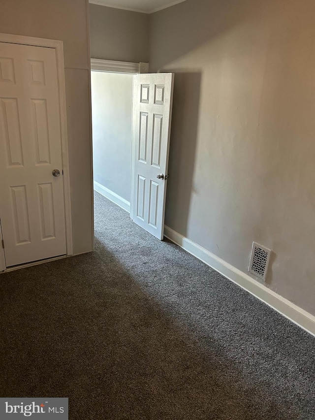 spare room featuring carpet