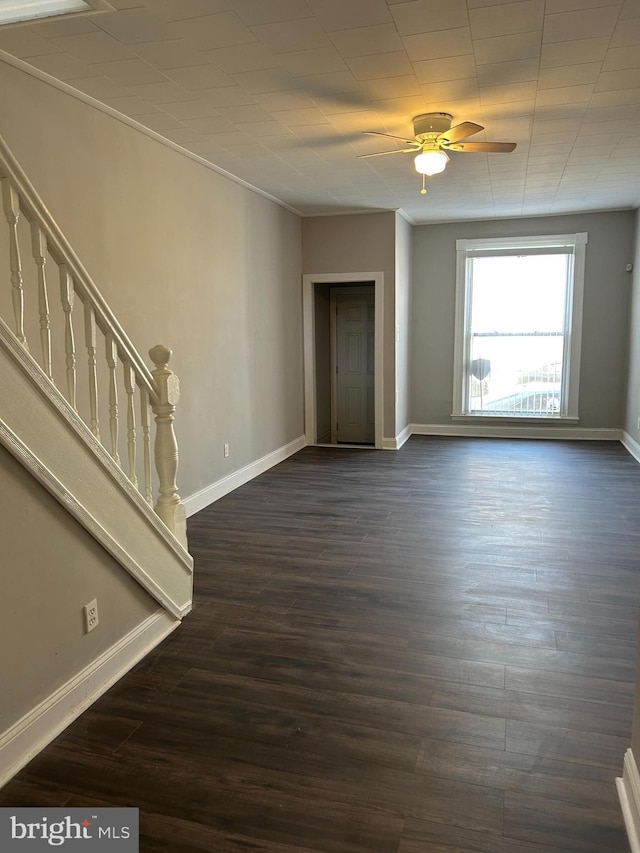 spare room featuring ornamental molding, ceiling fan, and dark hardwood / wood-style flooring