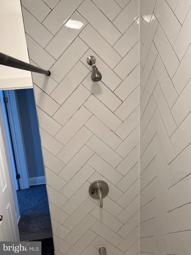 bathroom with a tile shower