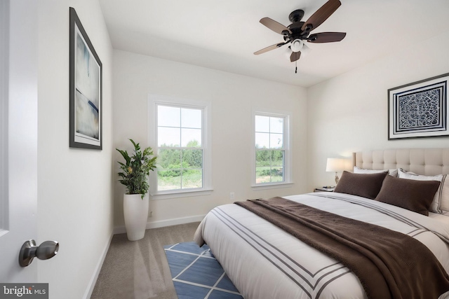 bedroom with light carpet and ceiling fan