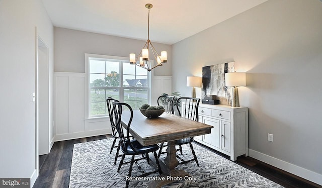 dining space featuring dark wood-type flooring and a notable chandelier