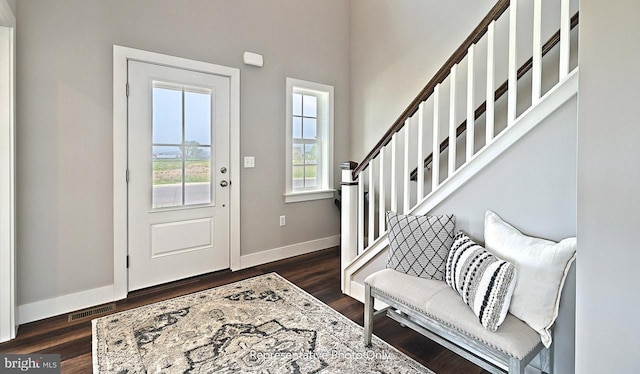 foyer with dark hardwood / wood-style flooring