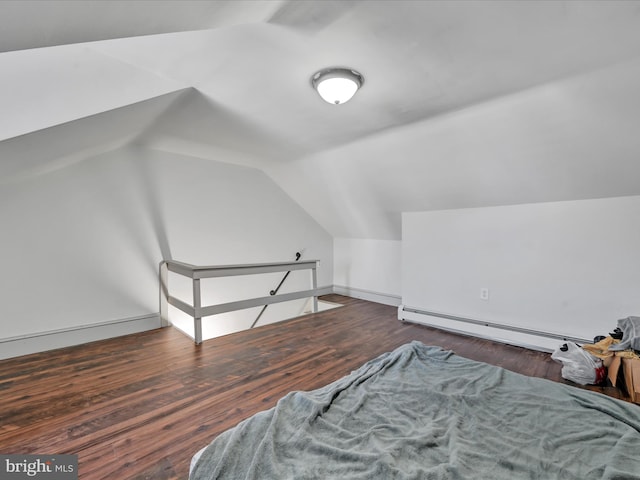 bonus room featuring dark hardwood / wood-style flooring, a baseboard radiator, and lofted ceiling