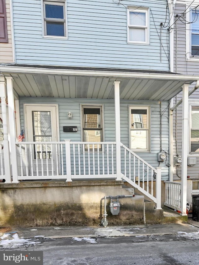 entrance to property with a porch