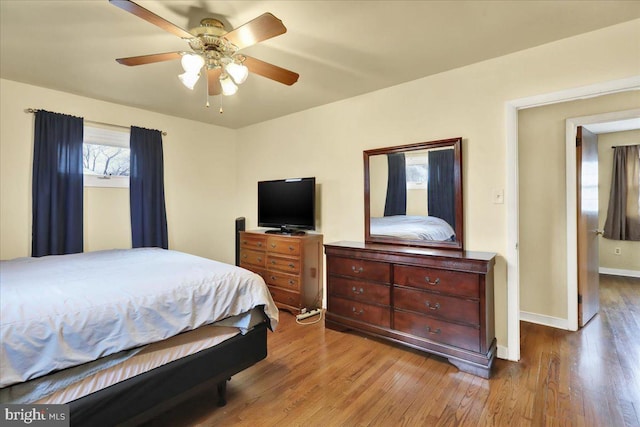 bedroom with ceiling fan and light hardwood / wood-style flooring