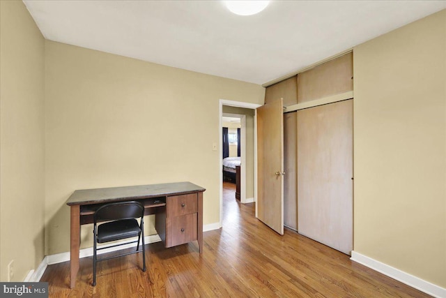 home office with hardwood / wood-style floors